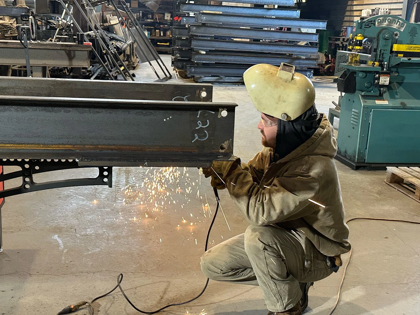 welder-grinding-steel-fabrication-shop.jpg