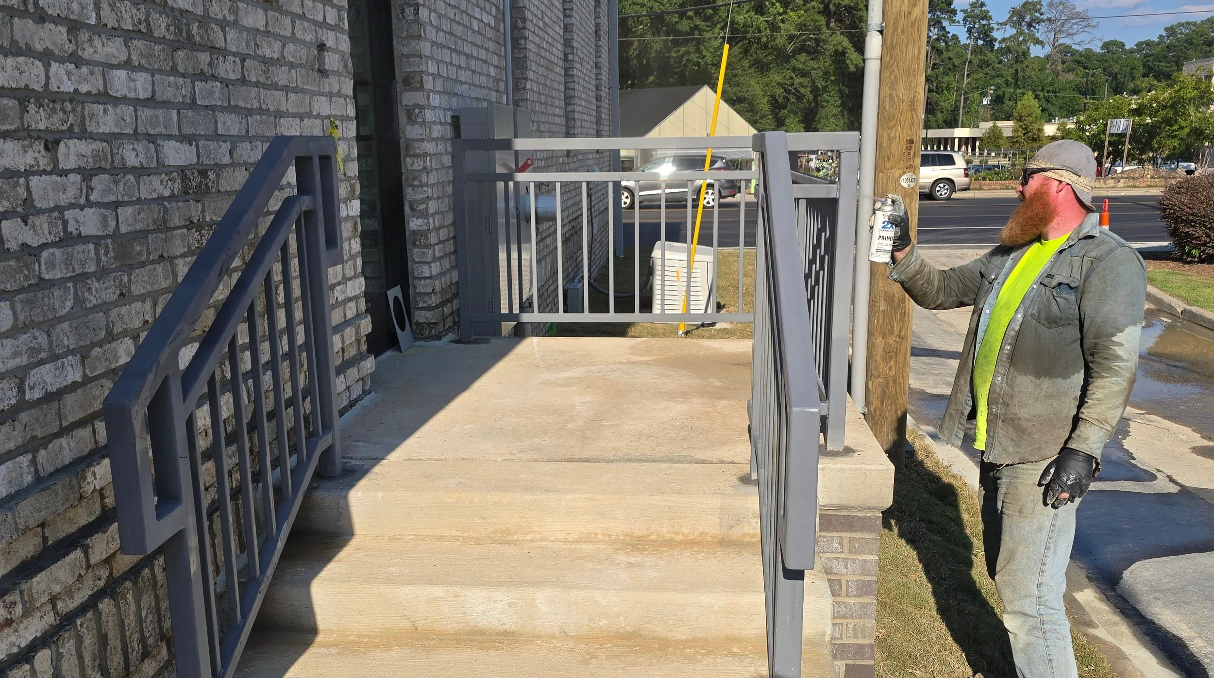 fabricator finishing work on handrails