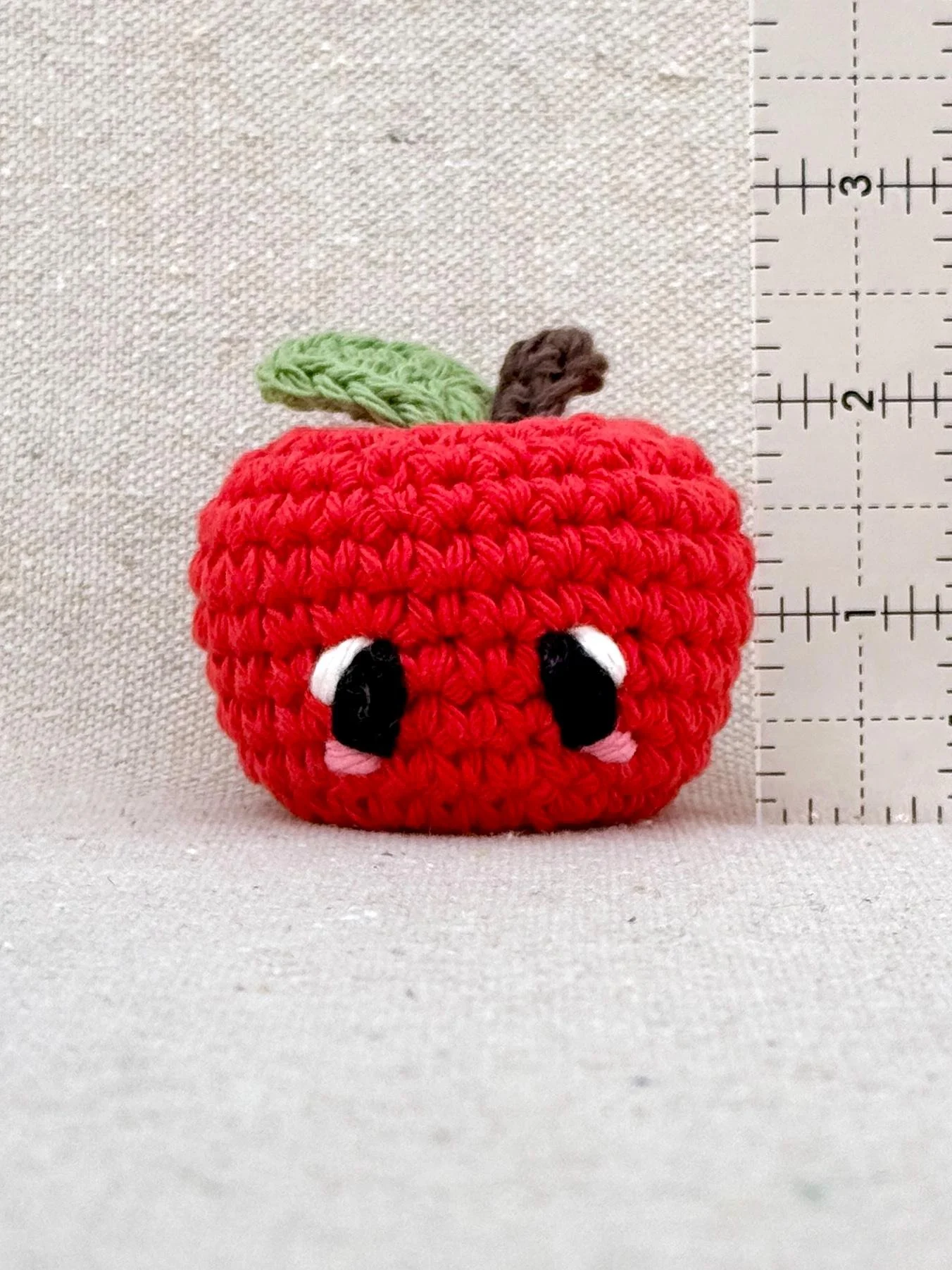 Crochet apple measuring 2 inches tall not including leaf or stem