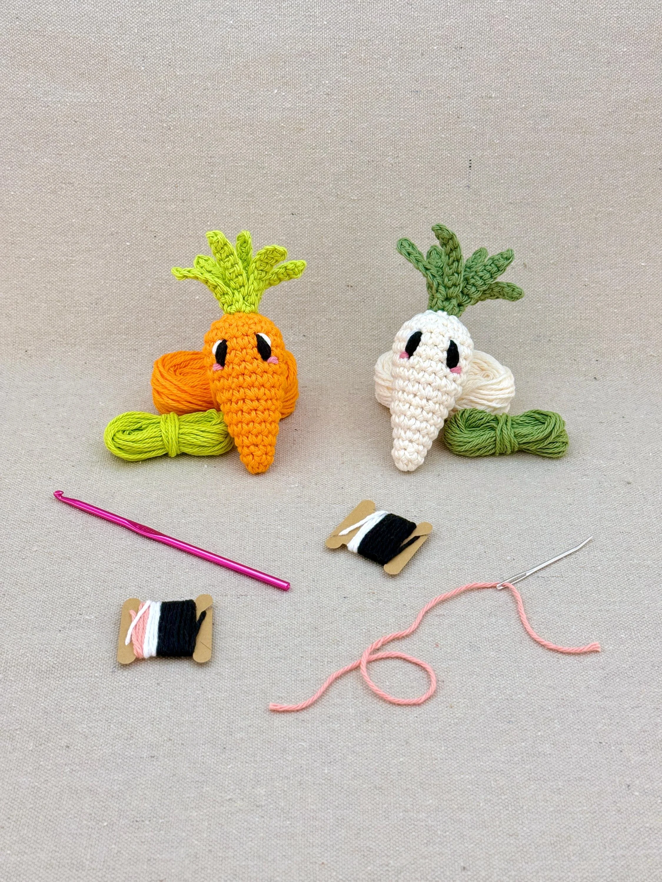 Two amigurmi carrots in orange and cream on matching colour yarn (Copy)