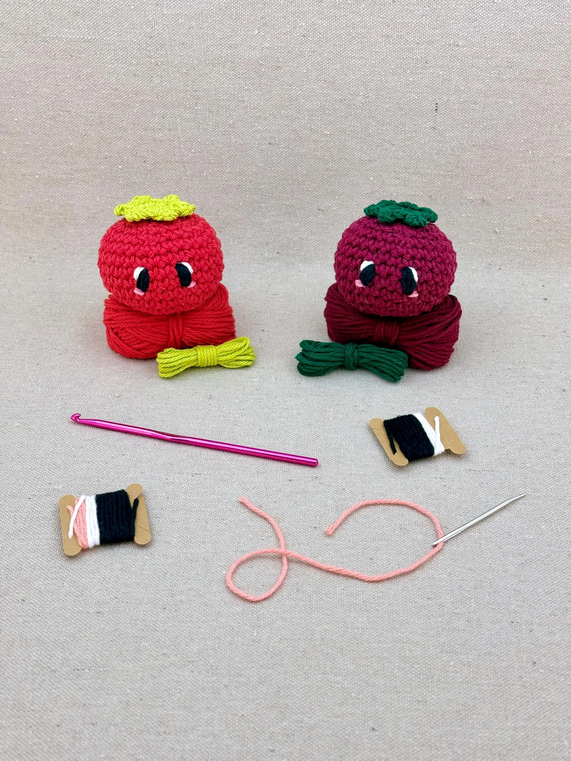 Two amigurmi tomatos in red and burgundy on matching colour yarn (Copy)