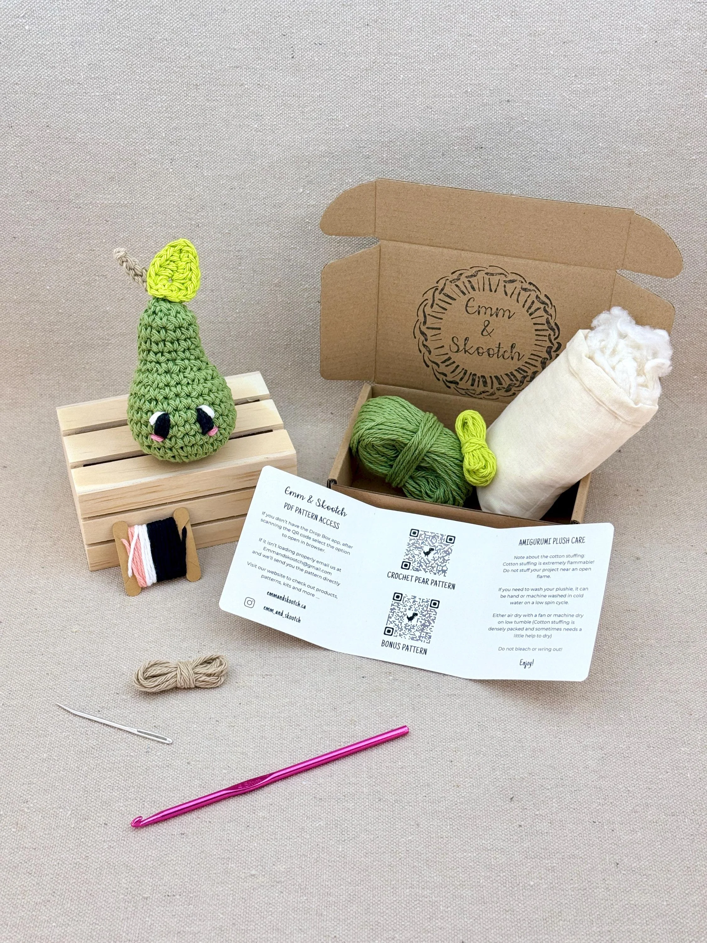 A finished sage green amigurumi pear with the DIY Crochet Kit