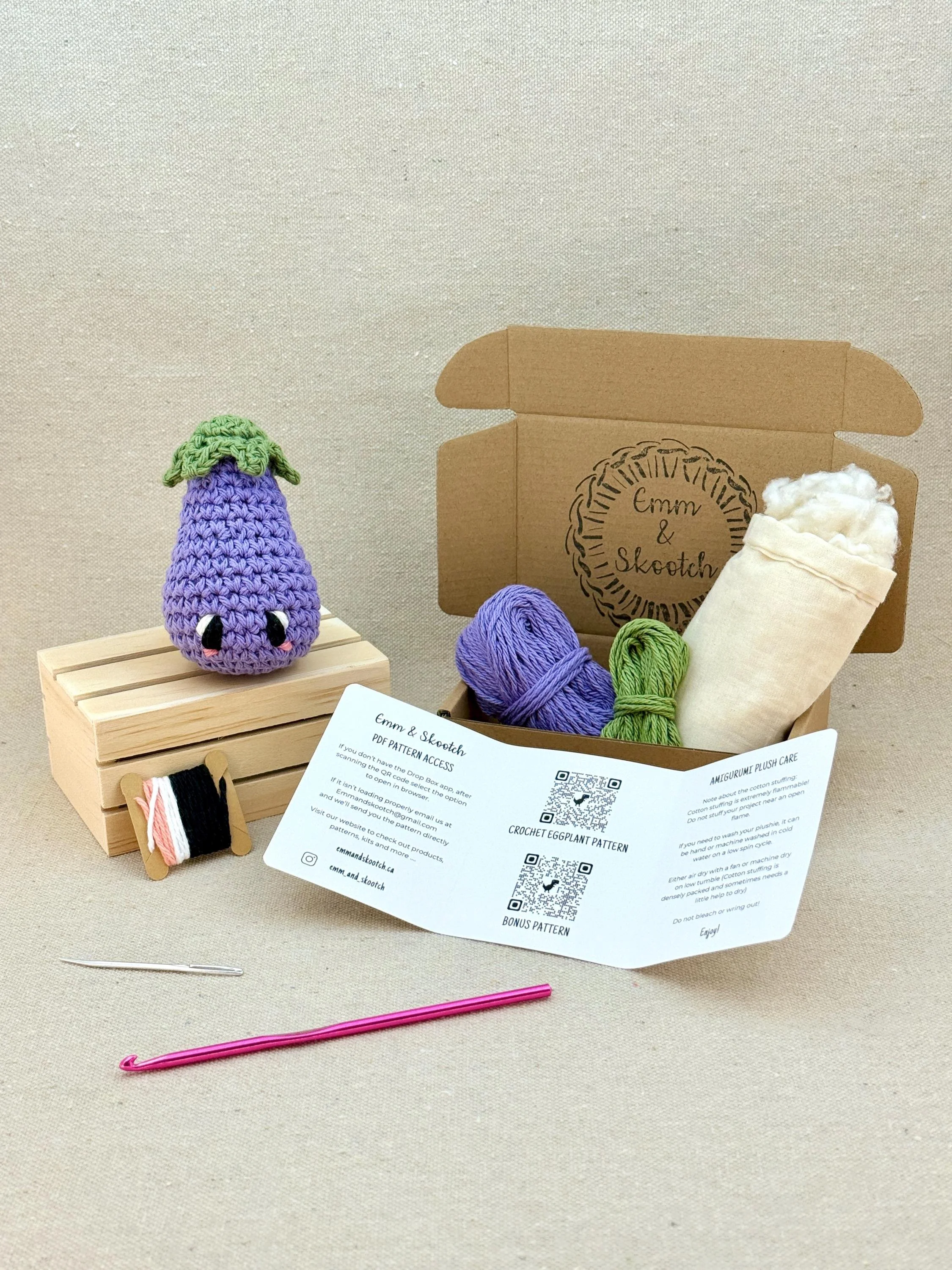 A finished light purple amigurumi eggplant with the DIY Crochet Kit