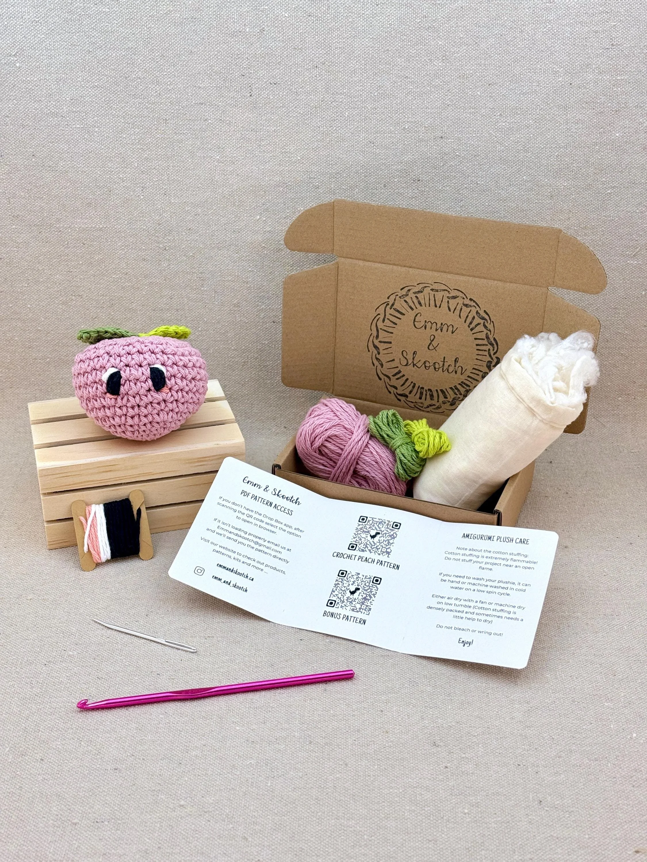 A finished bubblegum amigurumi peach with the DIY Crochet Kit