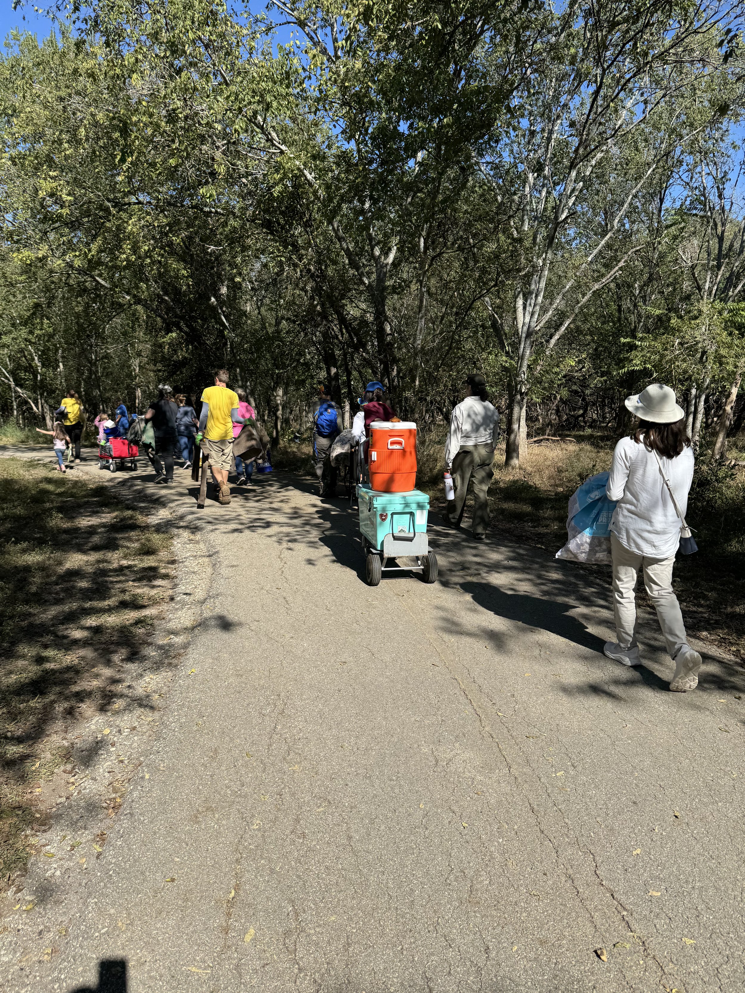 Volunteers moving to the cleanup site at Tobin Park