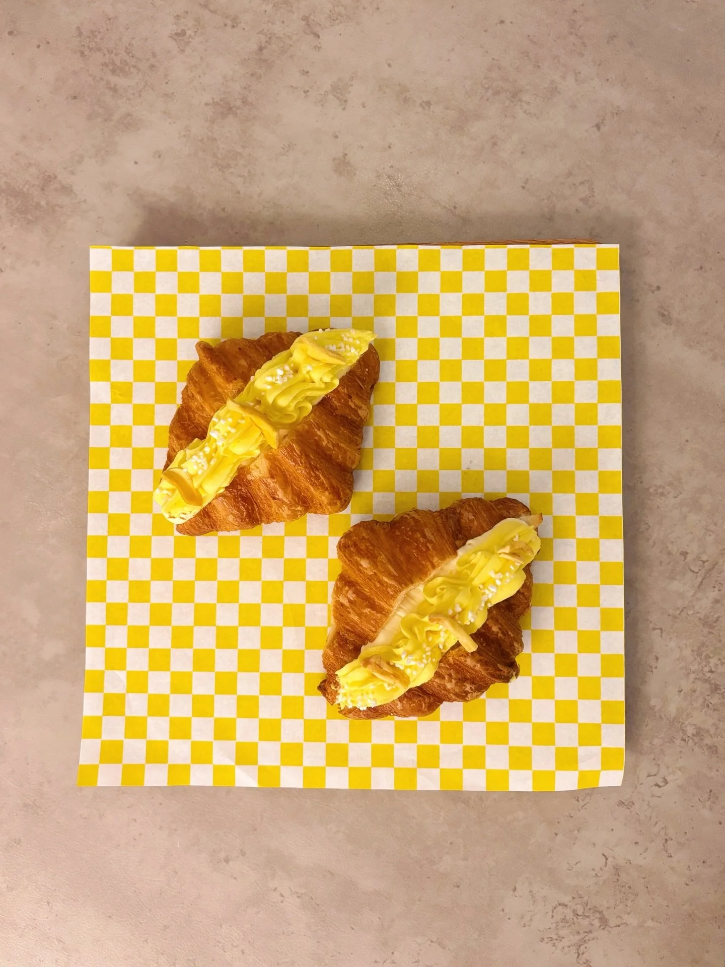 your sunshine on a cloudy day served by @panaderyasalvaje 🌤️✨

&mdash;
introducing the jackfruit cheesecake croissant 🥐 

made with:
- jackfruit jam + a creamy no-bake cheeesecake filling
- topped with jackfruit ganache, pearl sugar + dehydrated ja