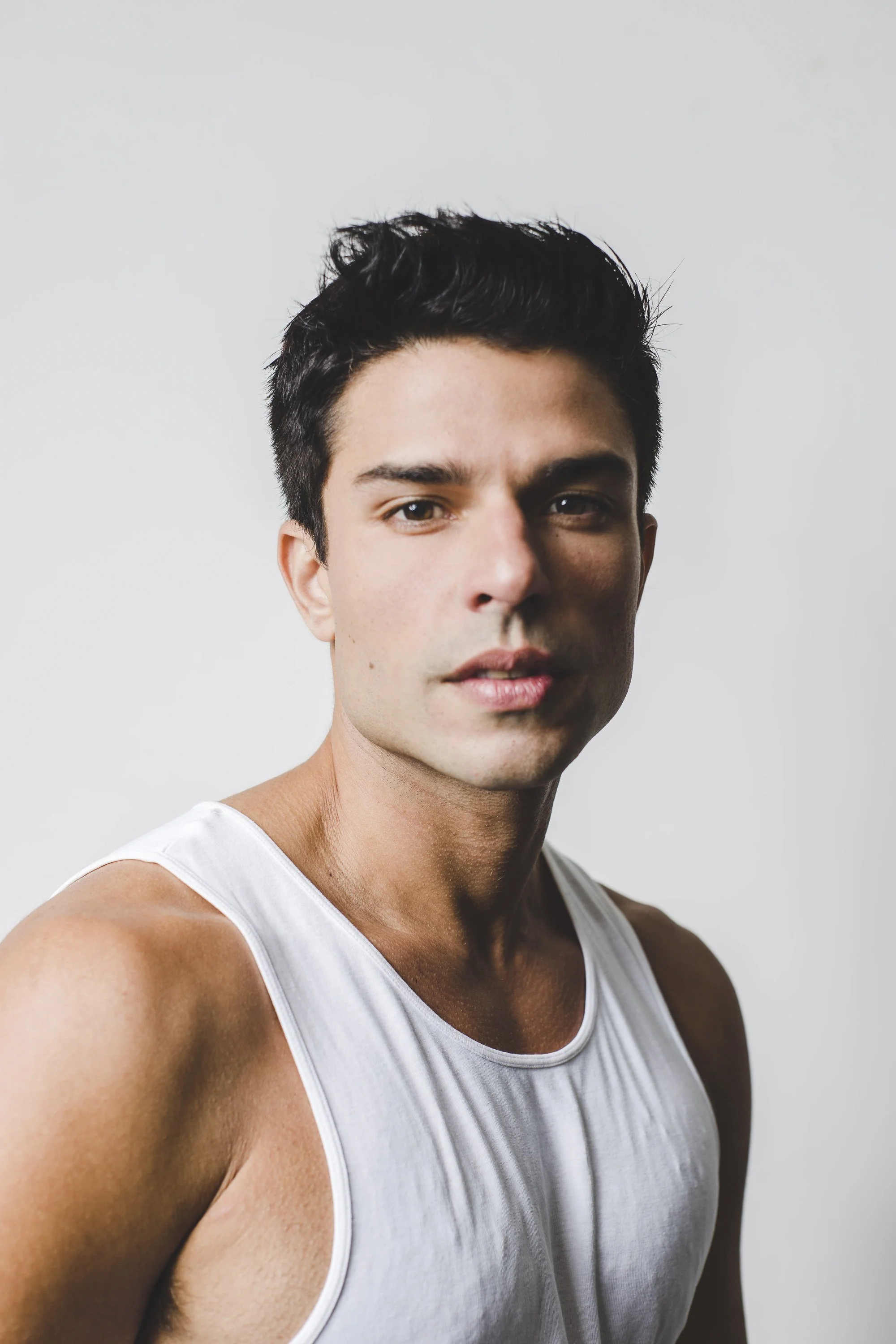 Studio portrait of actor Diego Montez photographed against a clean white background.