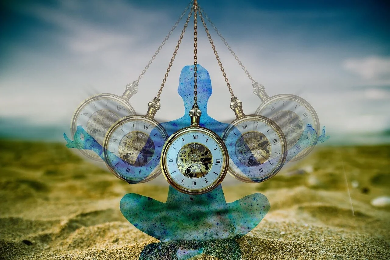 A digitally manipulated image featuring a silhouette of a person in a meditative pose with pocket watches hanging from chains in front of them meant to represent hypnotherapy.