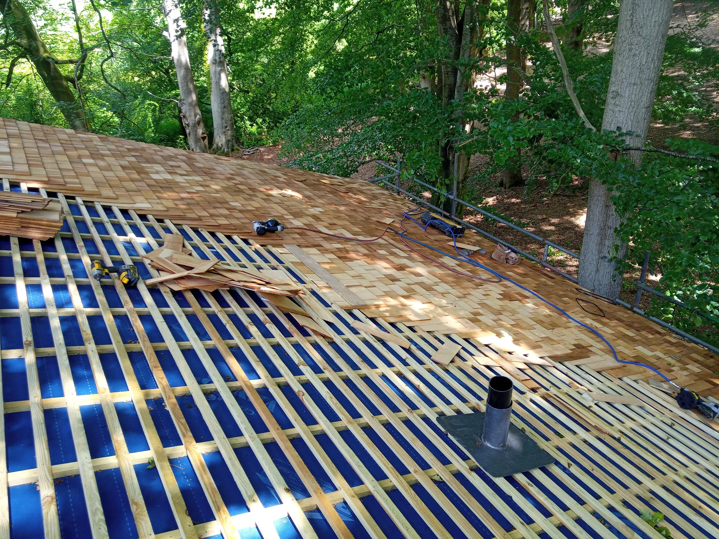 Tiling, slating  & other roofing works