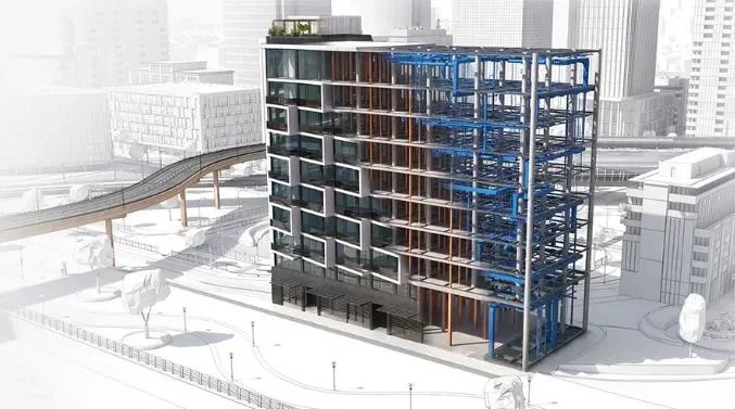 Edificio en construcción en una ciudad moderna, con estructura de acero visible y algunos pisos ya terminados.