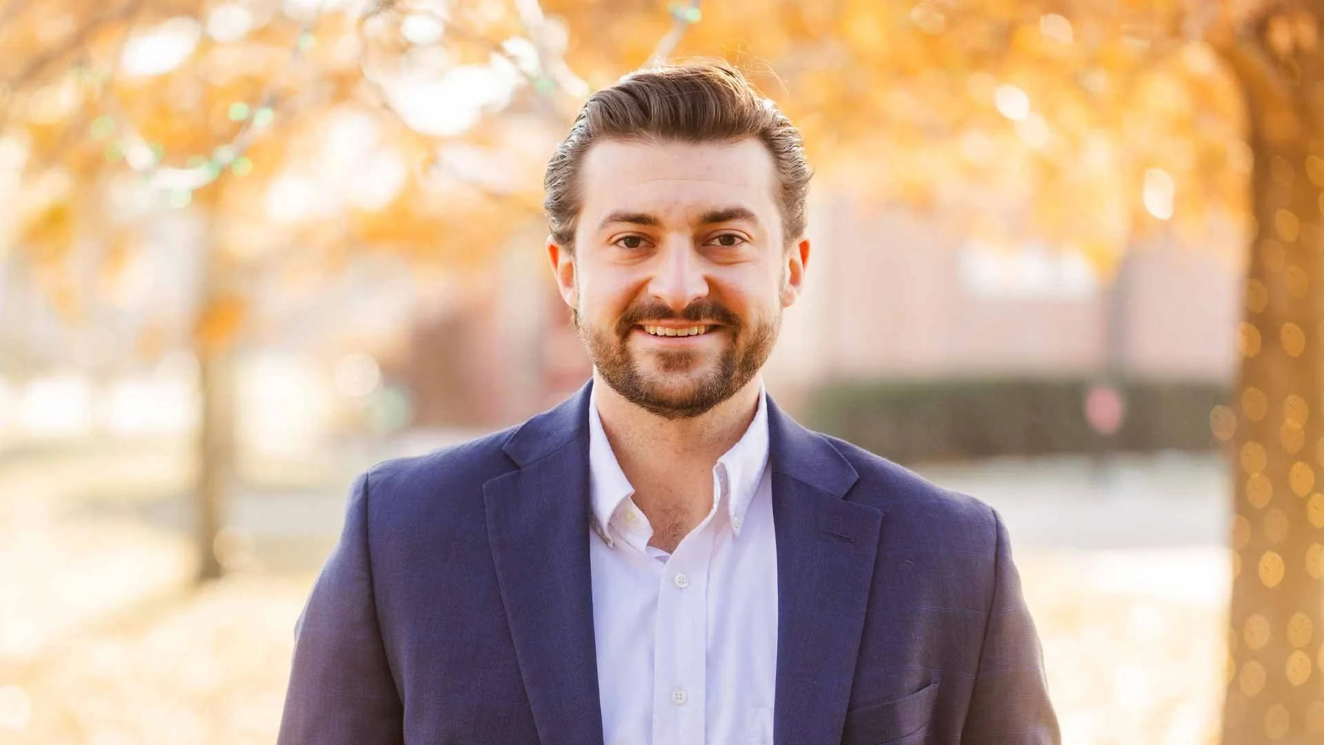 A portrait of Eli Wenzel, Democratic candidate for Ohio House District 60.