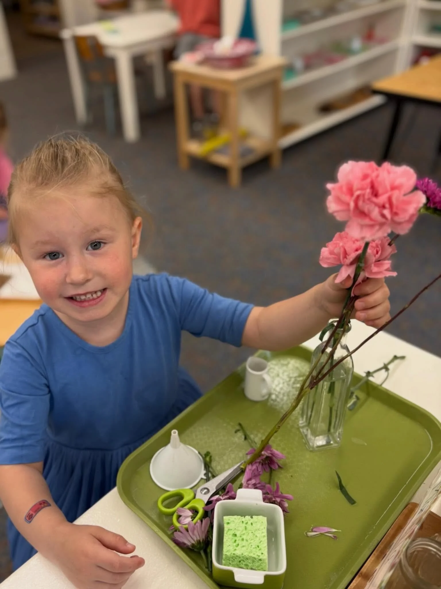 Through flower arranging, children strengthen fine motor skills, practice concentration and express creativity. Watching their pride as they carefully trim stems, pour water and create thoughtful arrangement is a reminder that purposeful work builds 
