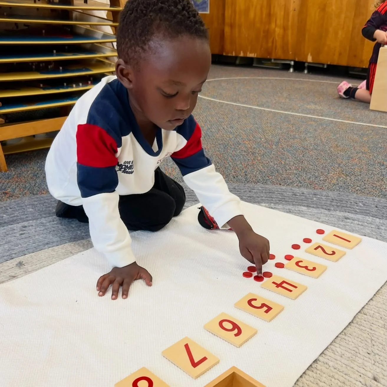 🔴 Little Red Counters, Big Mathematical Discoveries! 🔢

Our Numbers and Counters work helps children develop a concrete understanding of numbers and quantities as they carefully place red counters beneath each numeral from 1 to 10.

Children practi