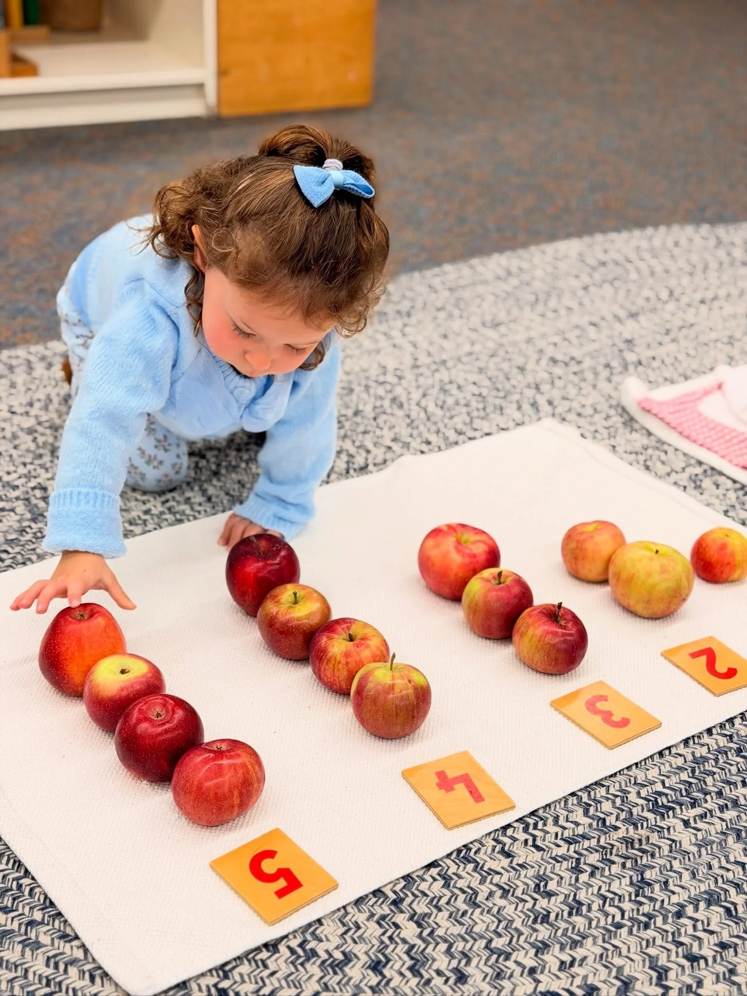 🍎🍏 An Apple a Day, the Montessori Way! 🍂

Apples have inspired so much hands-on learning in our classrooms this fall! From counting and identifying shapes to tasting different varieties and comparing their flavors, our students have been exploring
