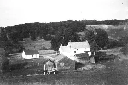 View of the farmhouse from high on the hill. (circa 1950).
