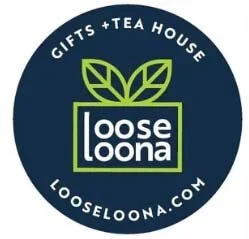 Logo for Loose Loona, a gifts and tea house, with a dark blue circular background, green leaves above the text, and the website looseloona.com.