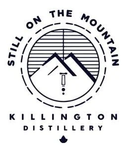 Logo with mountains and a moon or sun, text reads 'Still on the Mountain' and 'Killington Distillery'.