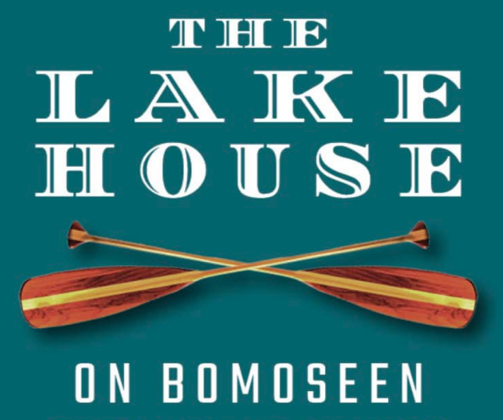 Book cover titled 'The Lake House on Bomoseen' with crossed wooden paddles against a teal background.