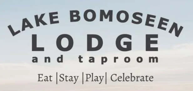 Sign for Lake Bomoseen Lodge and Taproom with the words Eat, Stay, Play, Celebrate