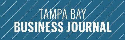 Tampa Bay Business Journal logo with white text on a blue background with diagonal lines