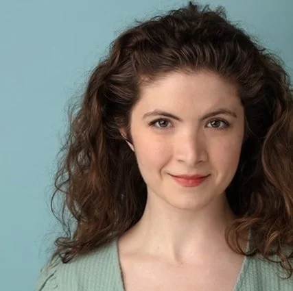 A headshot of actress, writer, teacher, and producer Grace Olinski