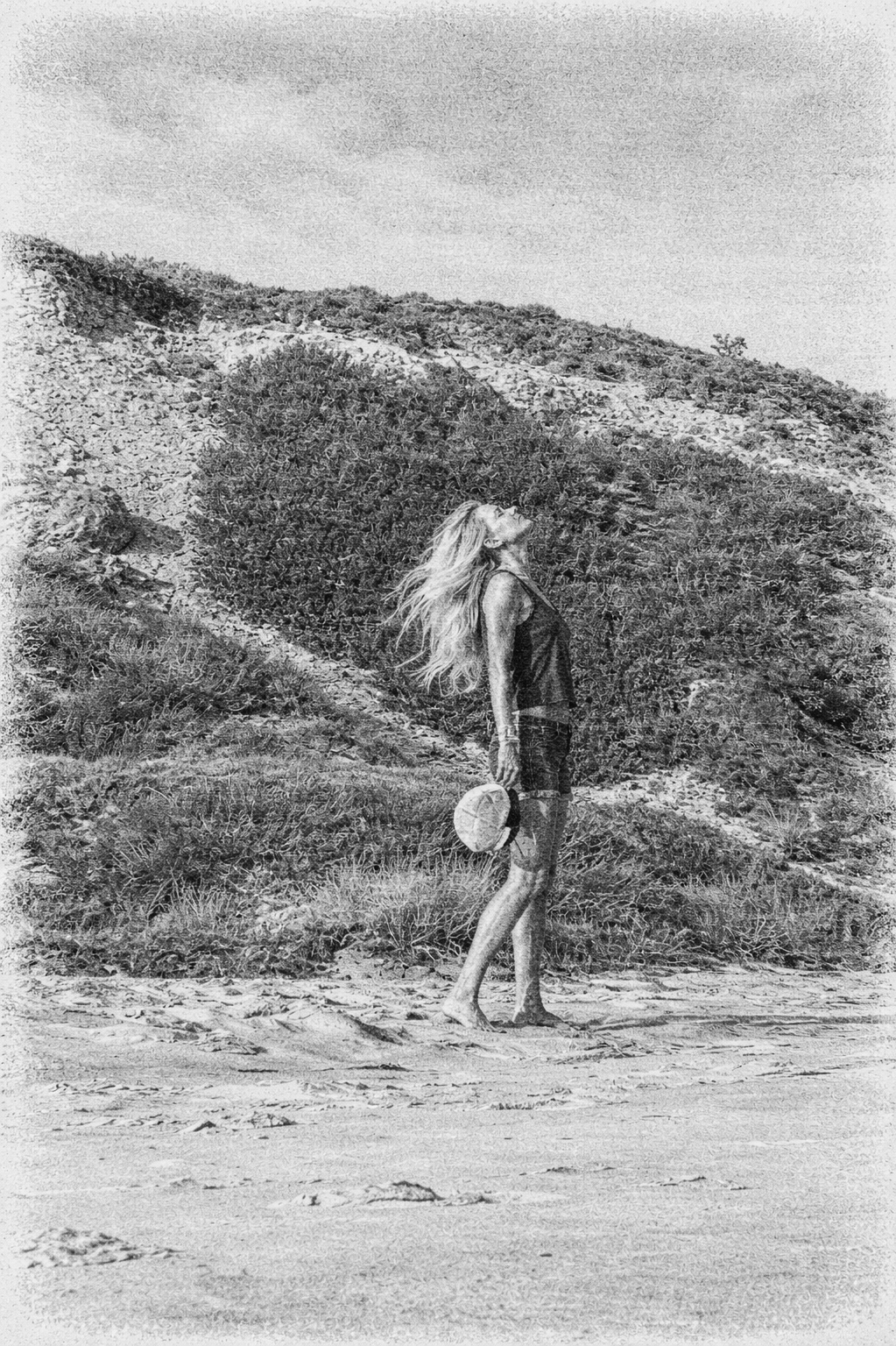 woman standing on a beach reflecting on emotional triggers in relationships and personal growth