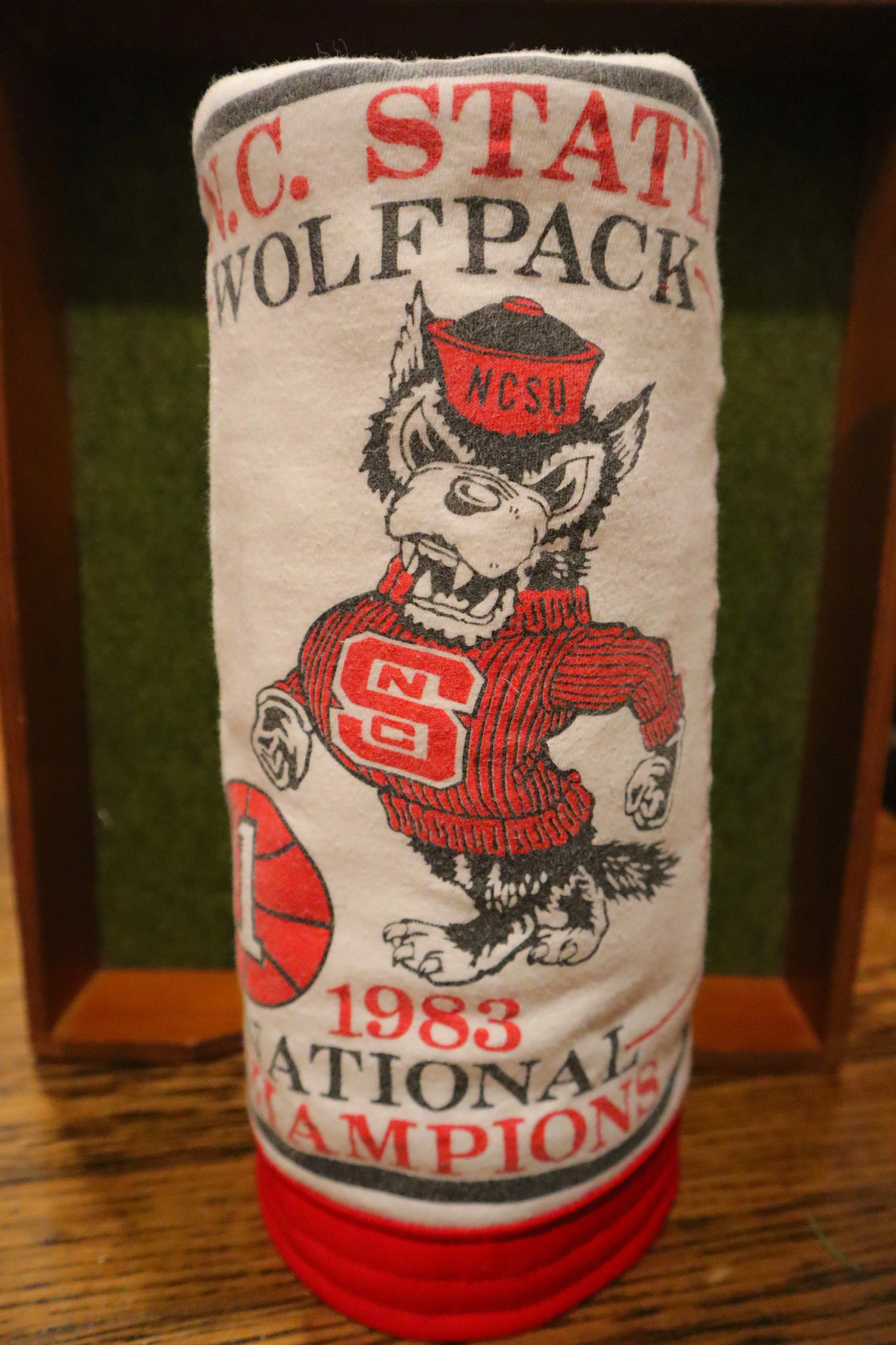 North Carolina State University Wolfpack towel celebrating the 1983 national championship, featuring the Wolf mascot and team logo.