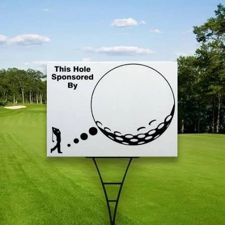 Golf driving range billboard with a large golf ball graphic and a golfer silhouette, advertising sponsored hole.
