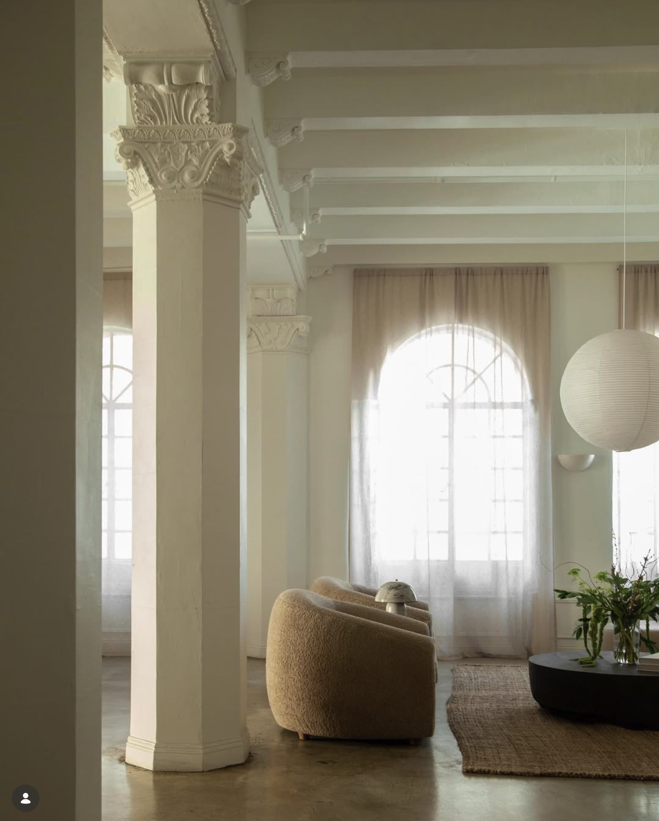 photo of light-filled living room with intricately designed columns