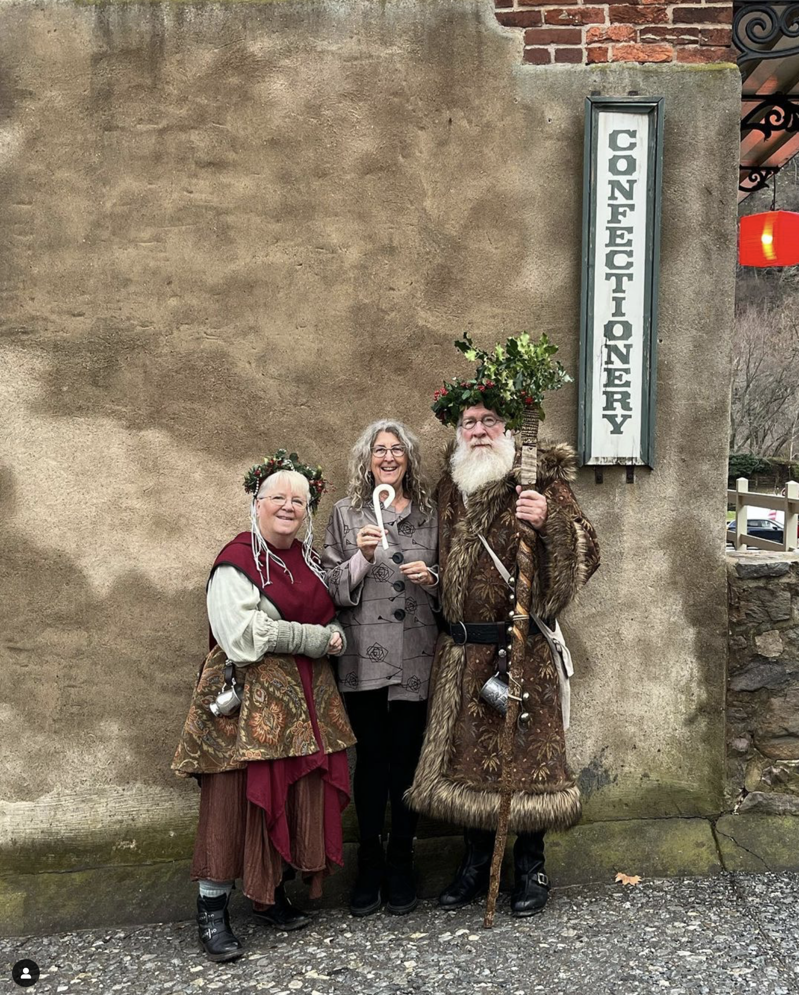 vintage santa and mrs claus standing in front of Harpers Ferry General Store
