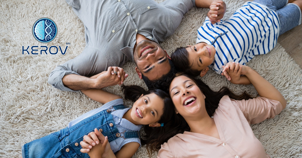 Happy family of four smiling — bring brain training home with Kerov Health Orlando