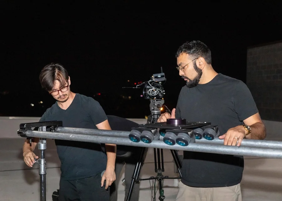 Alexander Nunn and Roman Aguirre adjust dolly