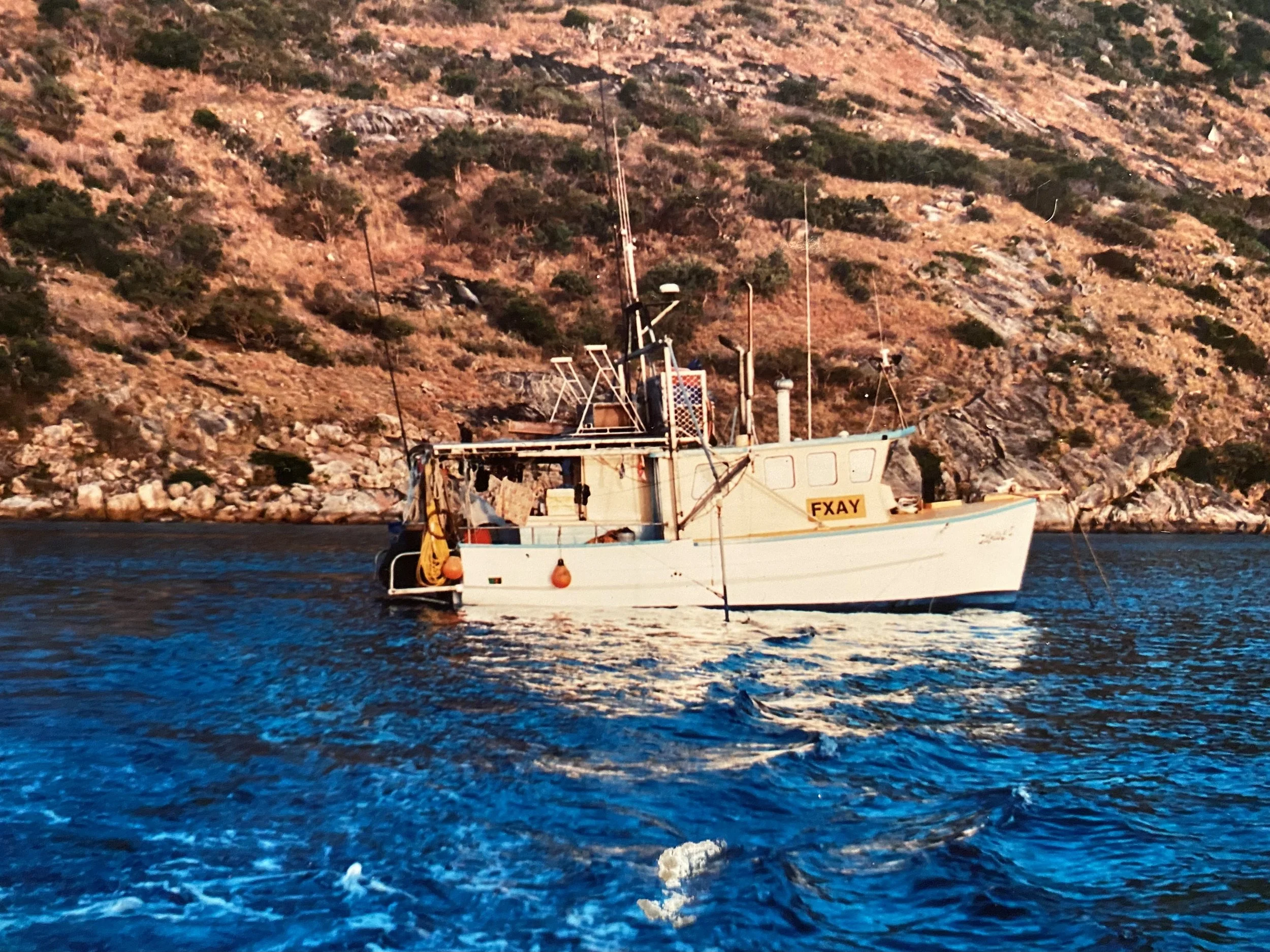 Jackson Kubian as a young boy who grew up on a boat.