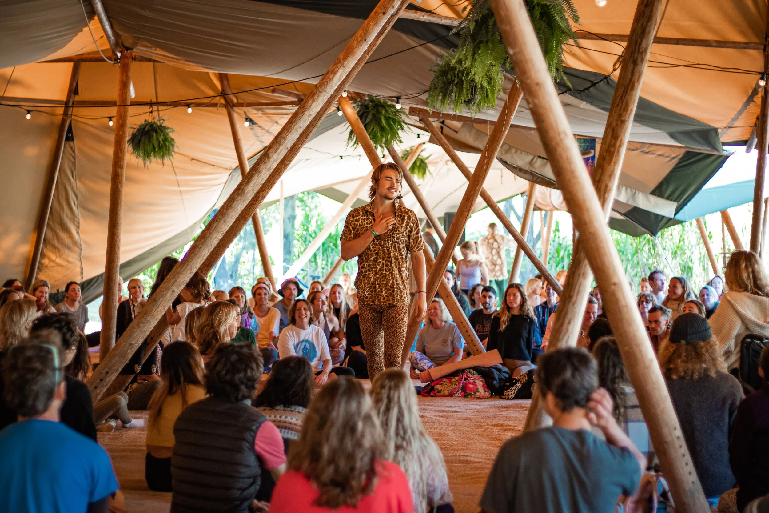 Jackson Kubian facilitating a transformational dance workshop to 100+ participants.