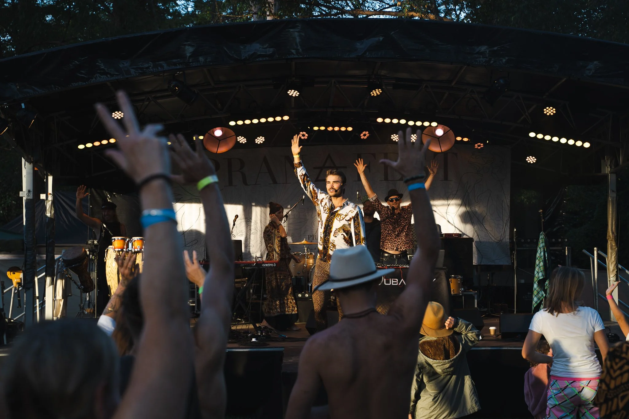 Jackson Kubian facilitating and MCing on stage at Pranafest.