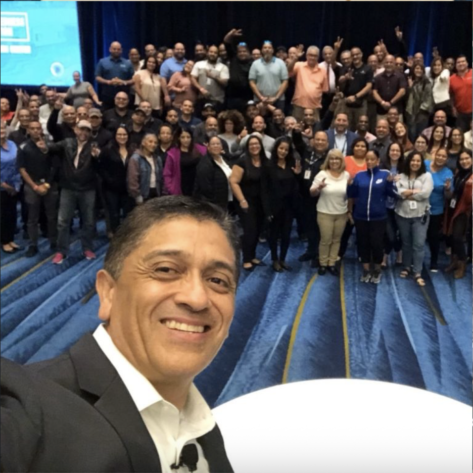 Mark Herrera takes a selfie with his training attendees in Puerto Rico.