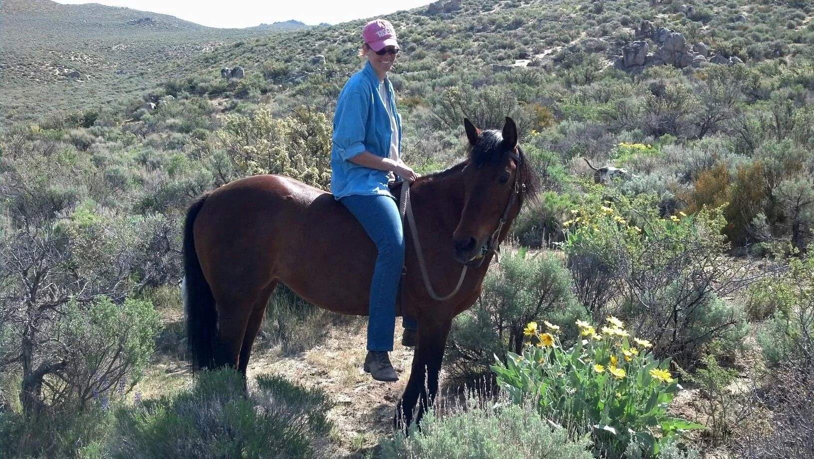 Us riding our favorite mountain with her favorite snack flowers blooming.