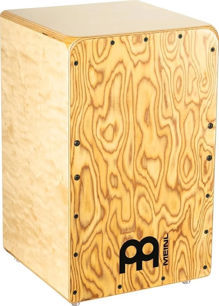 A wooden cajón percussion instrument with a natural wood finish and a black logo on the front panel.