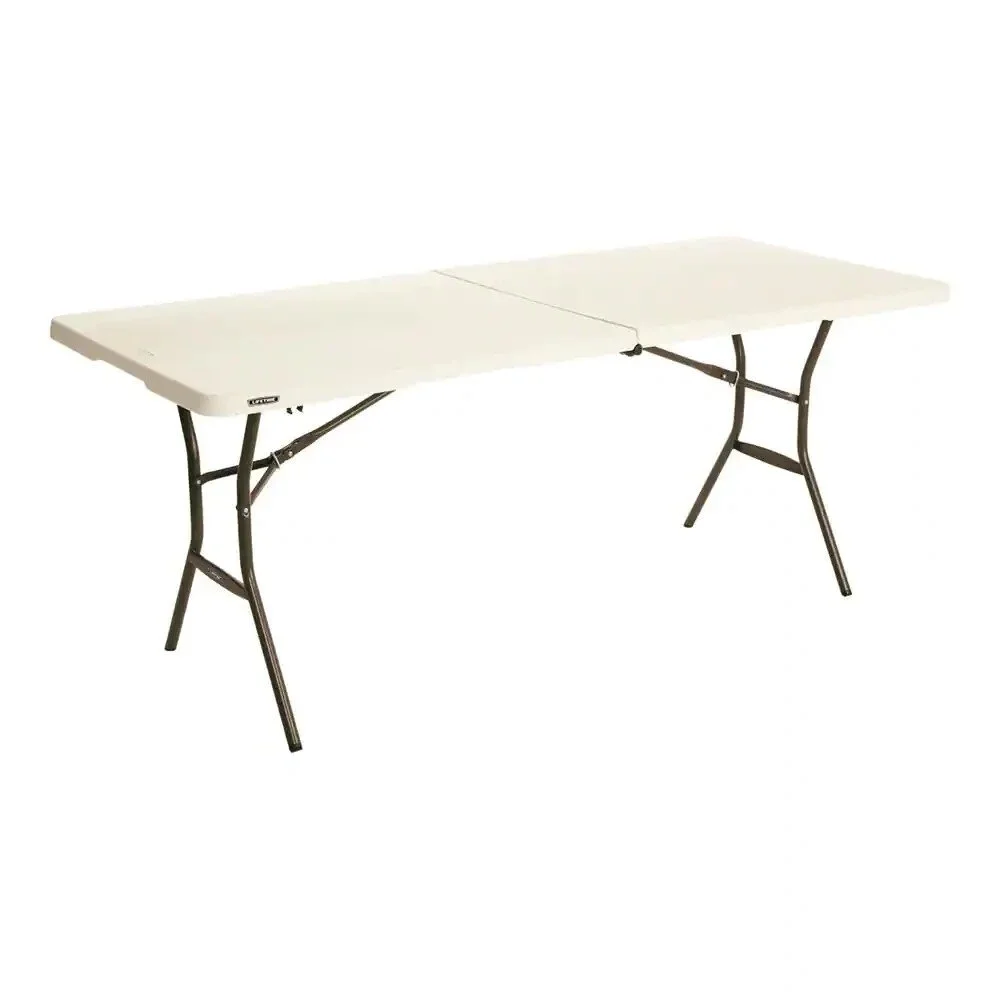 A foldable white table with black metal legs extended, standing against a plain white background.
