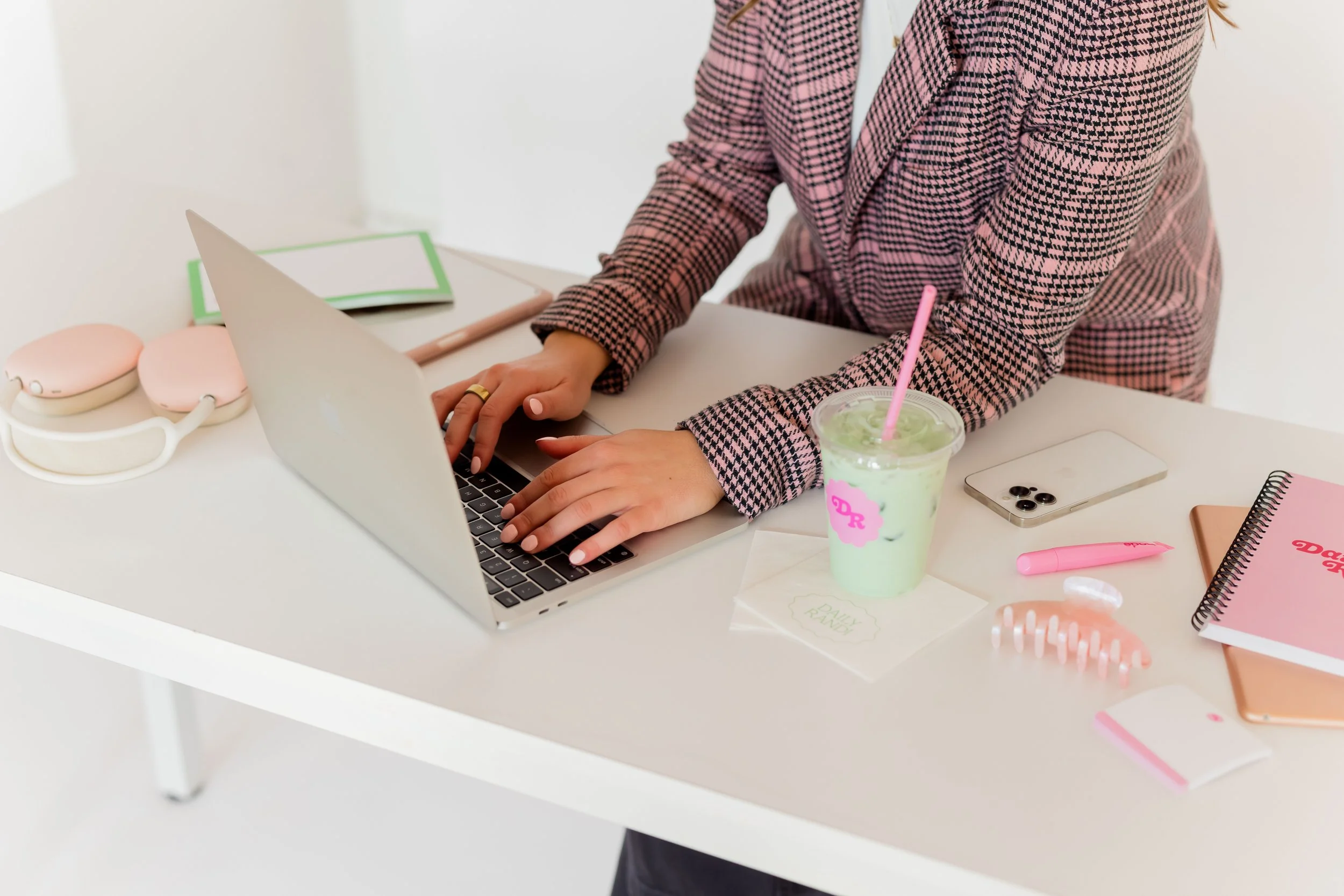 Instagram coach workspace with laptop, branded matcha, and planning materials for content strategy sessions