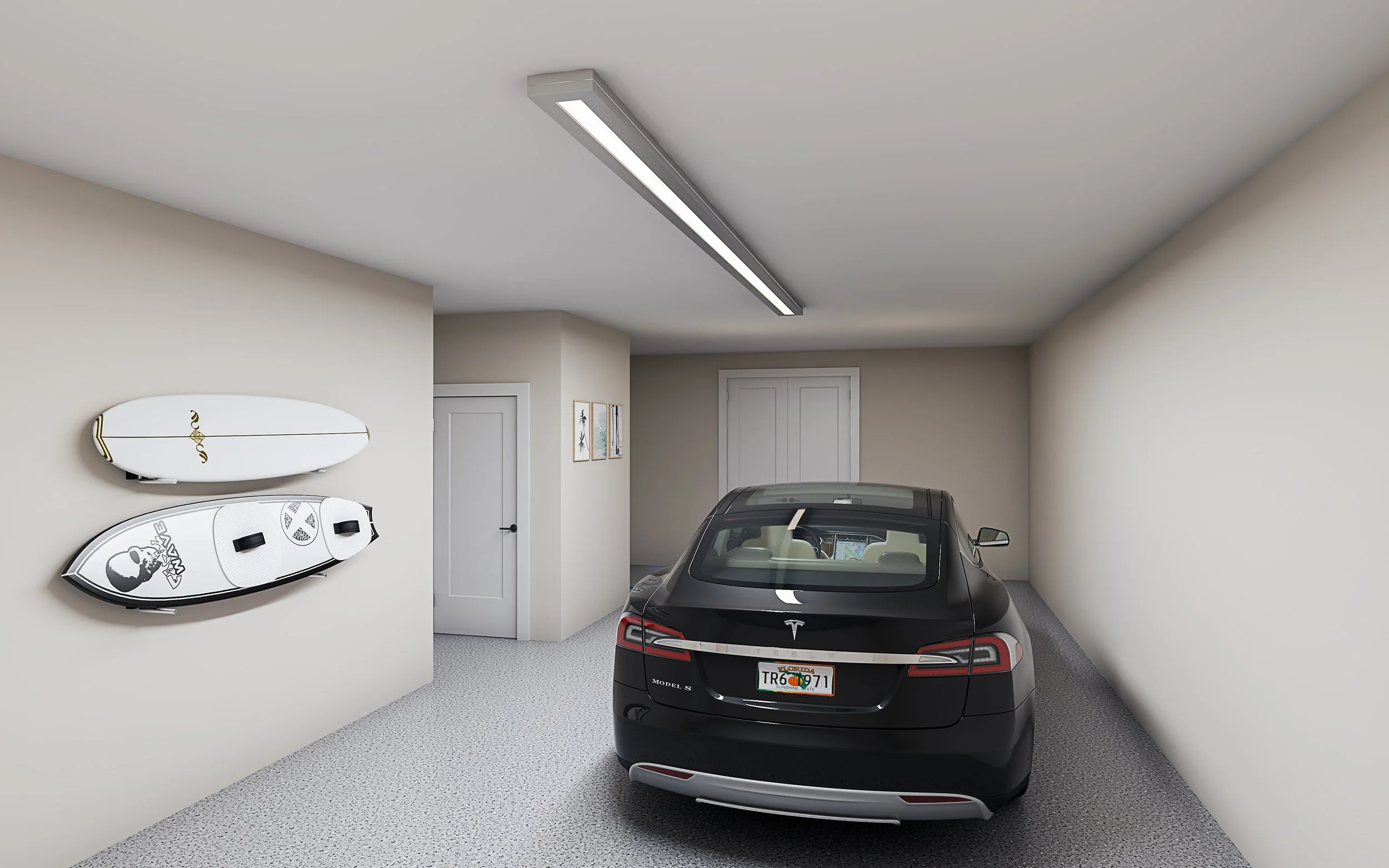 A modern indoor garage with a black Tesla Model 3, two surfboards mounted on the wall, and artwork on the walls.