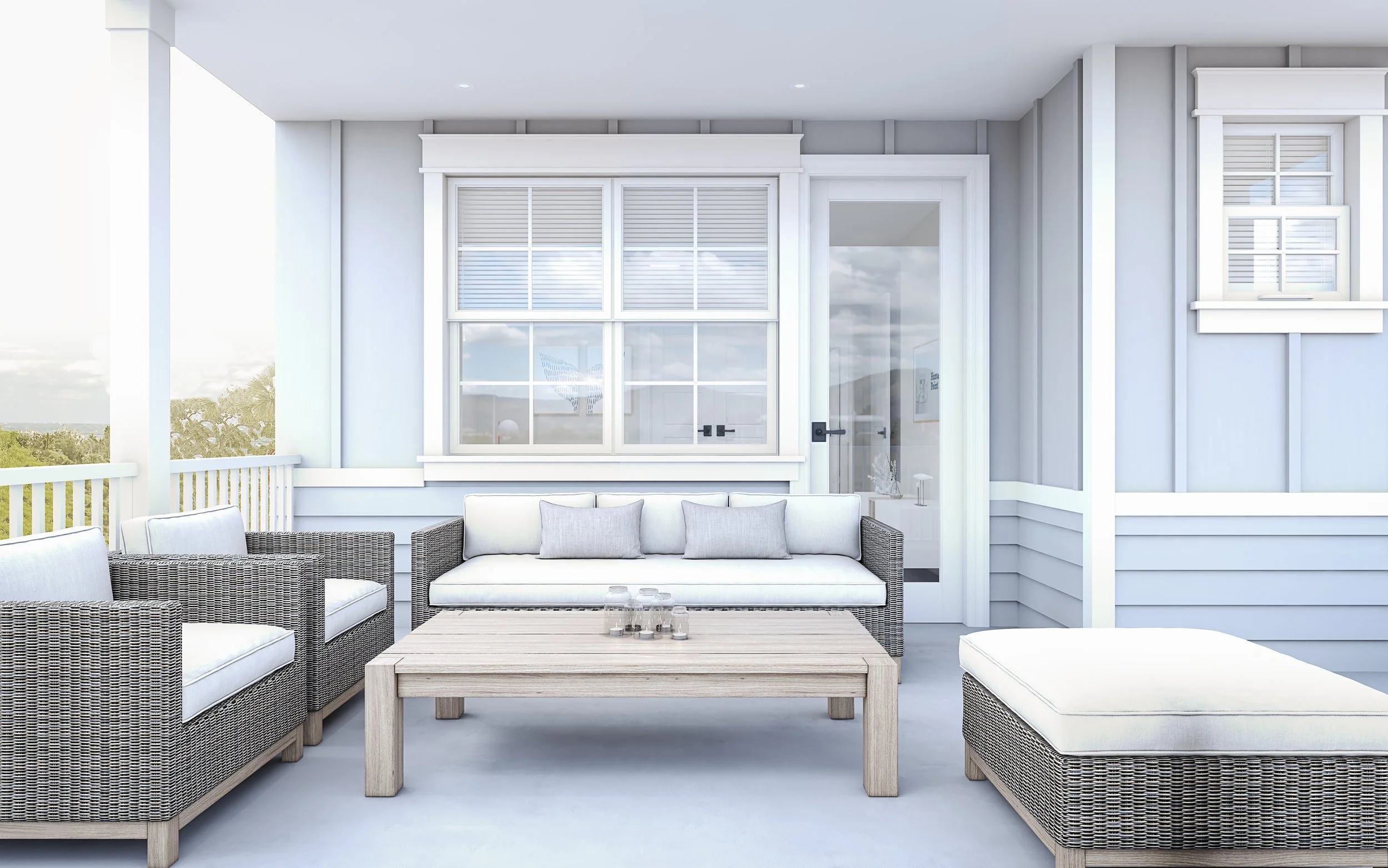 Outdoor balcony with wicker furniture, white cushions, and a wooden coffee table, overlooking a scenic view with trees.