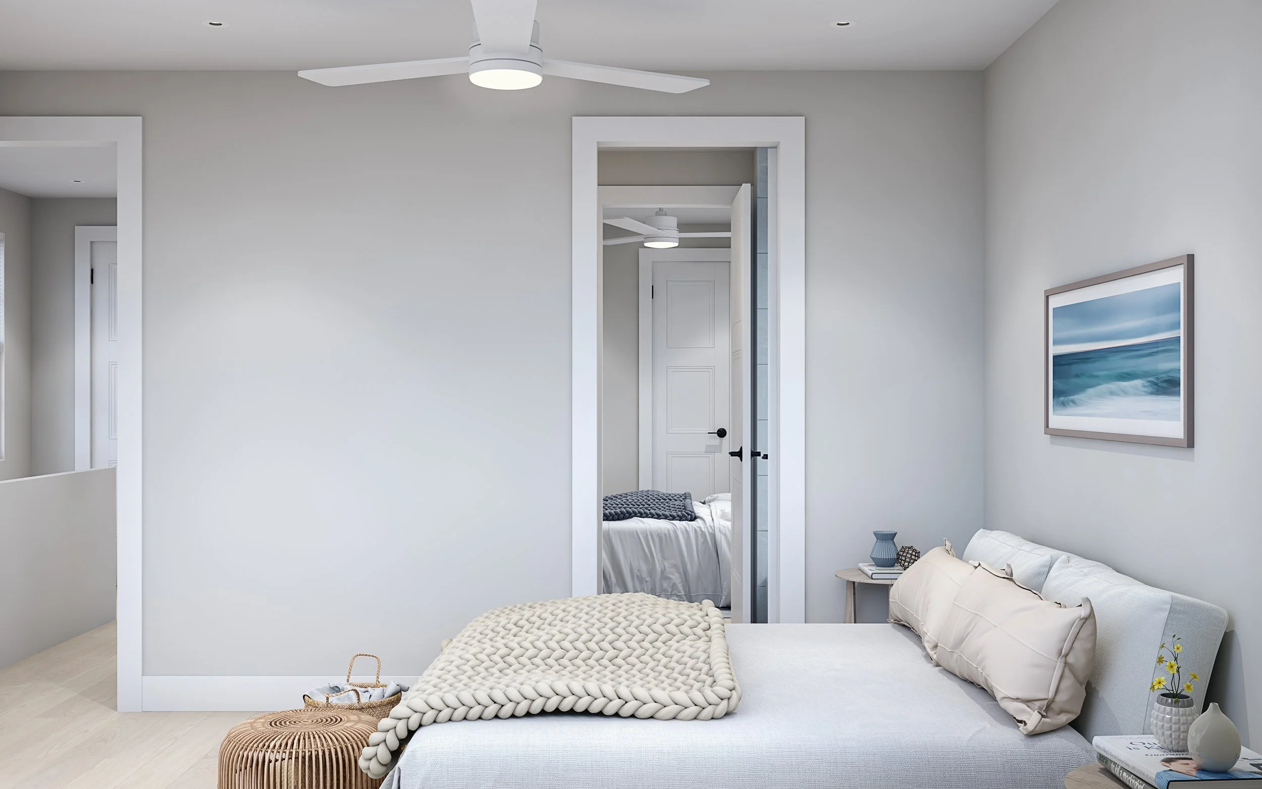 A minimalistic bedroom with a light-colored bed, pillows, and blanket. A small side table with decorative items and a framed ocean painting on the wall. A doorway leads to another bedroom.