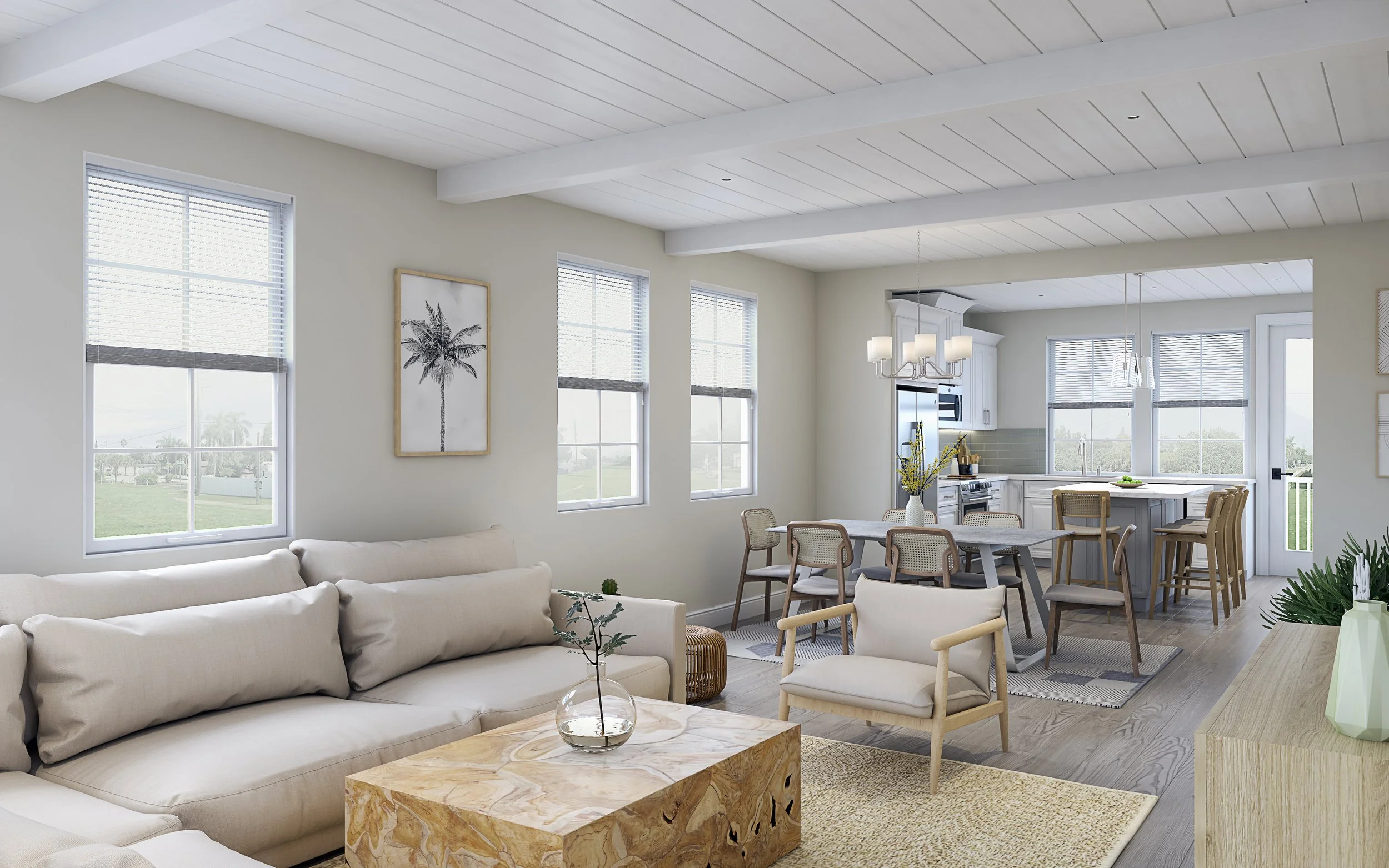 Open-concept living and dining area with a view of the kitchen, white sofa, wooden coffee table, and large windows letting in natural light.