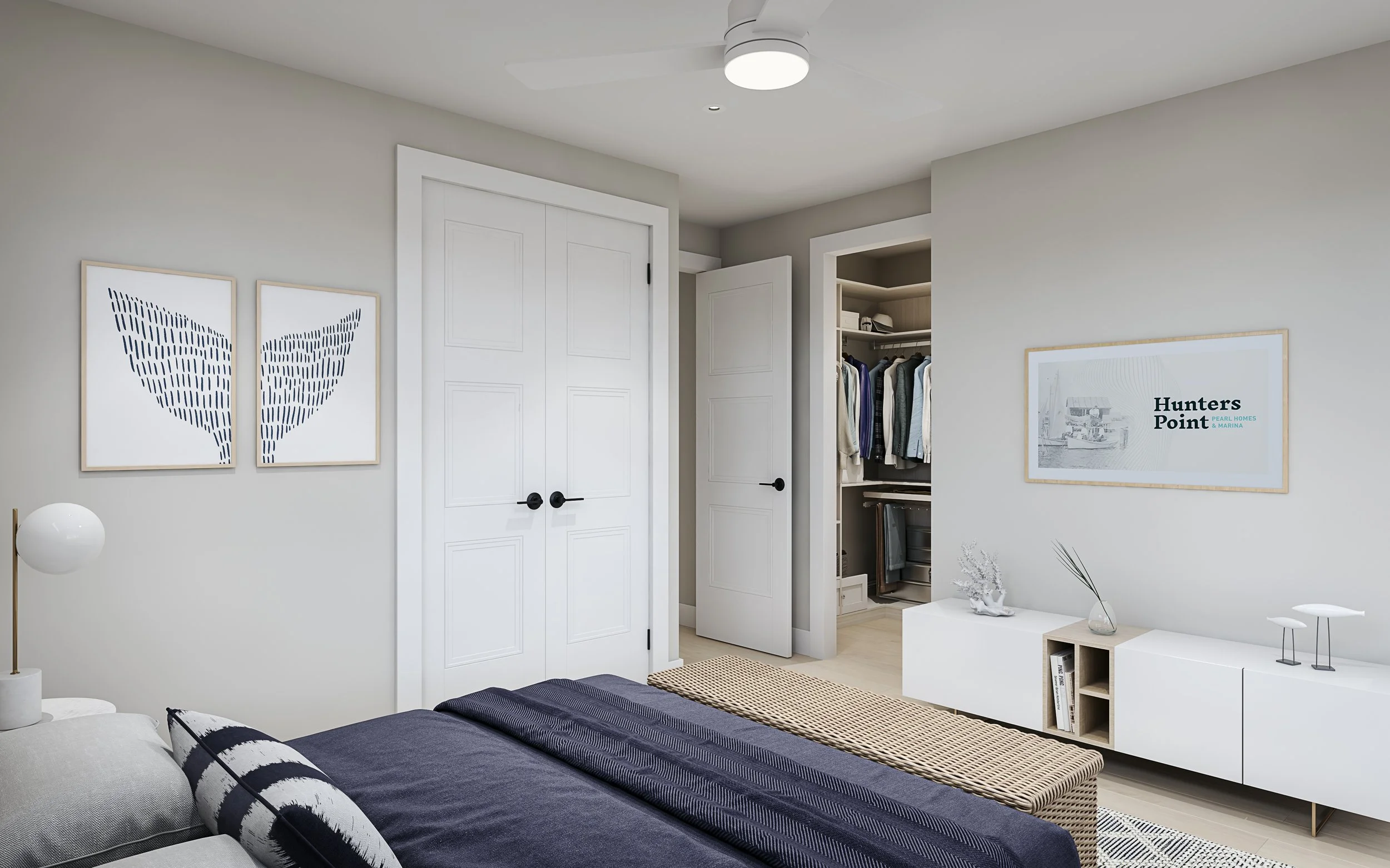 Modern bedroom with white walls and decor, including framed abstract art, a white sideboard with plants, a bed with navy and black bedding, and an open closet with clothing and shelves.