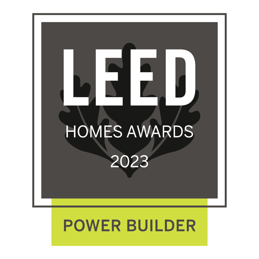 A black, gray, and yellow award badge for the 2023 LEED Homes Awards, with a leaf design in the background and the words "Power Builder" at the bottom.