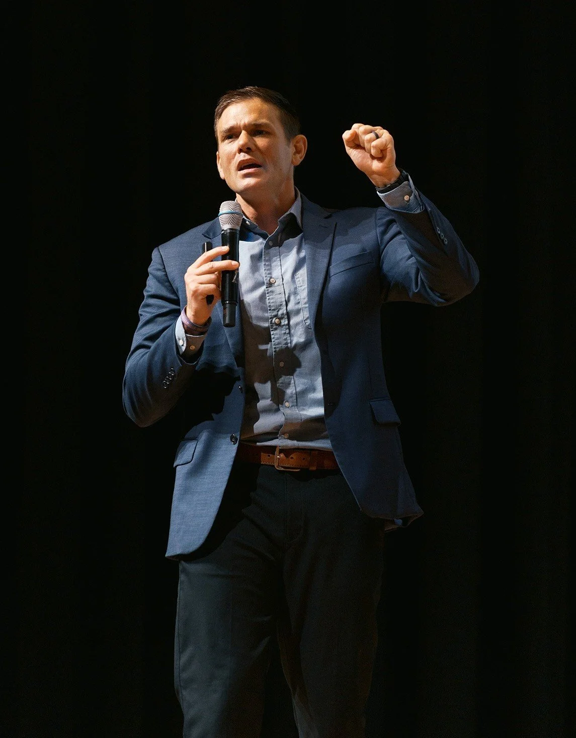 Speaker, Justin Pickens, presenting on stage