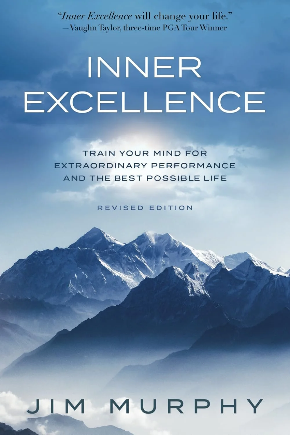 Book cover titled "Inner Excellence" by Jim Murphy, featuring a mountain range with snow-capped peaks and a cloudy sky, with a quote about inner excellence at the top.