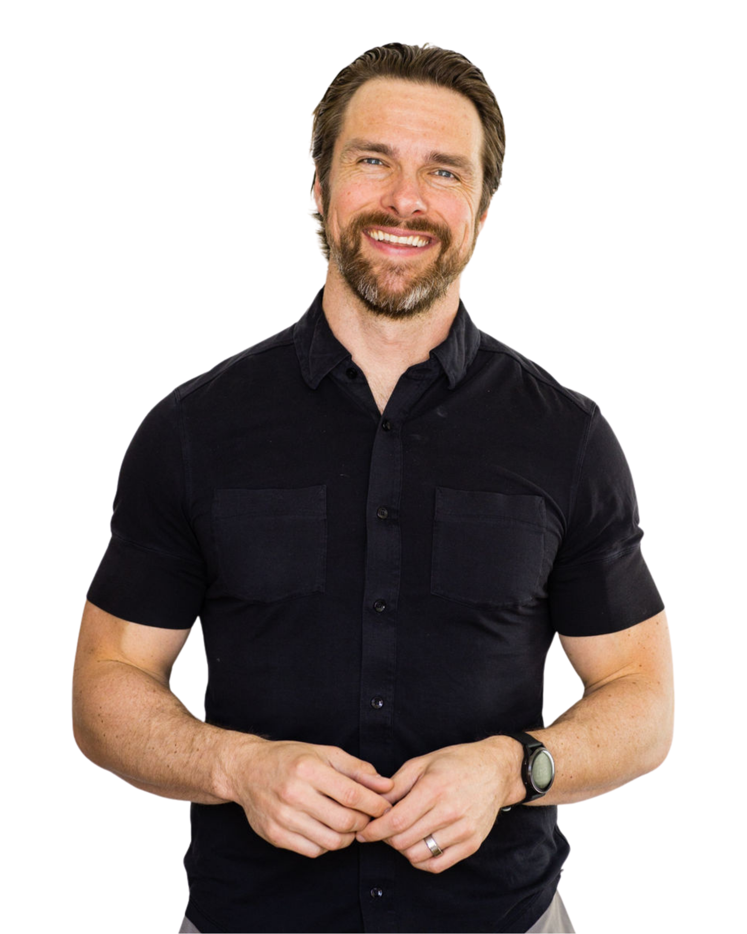 Smiling man with a beard and mustache wearing a black short-sleeve button-up shirt and a watch on his left wrist, standing against a white background.