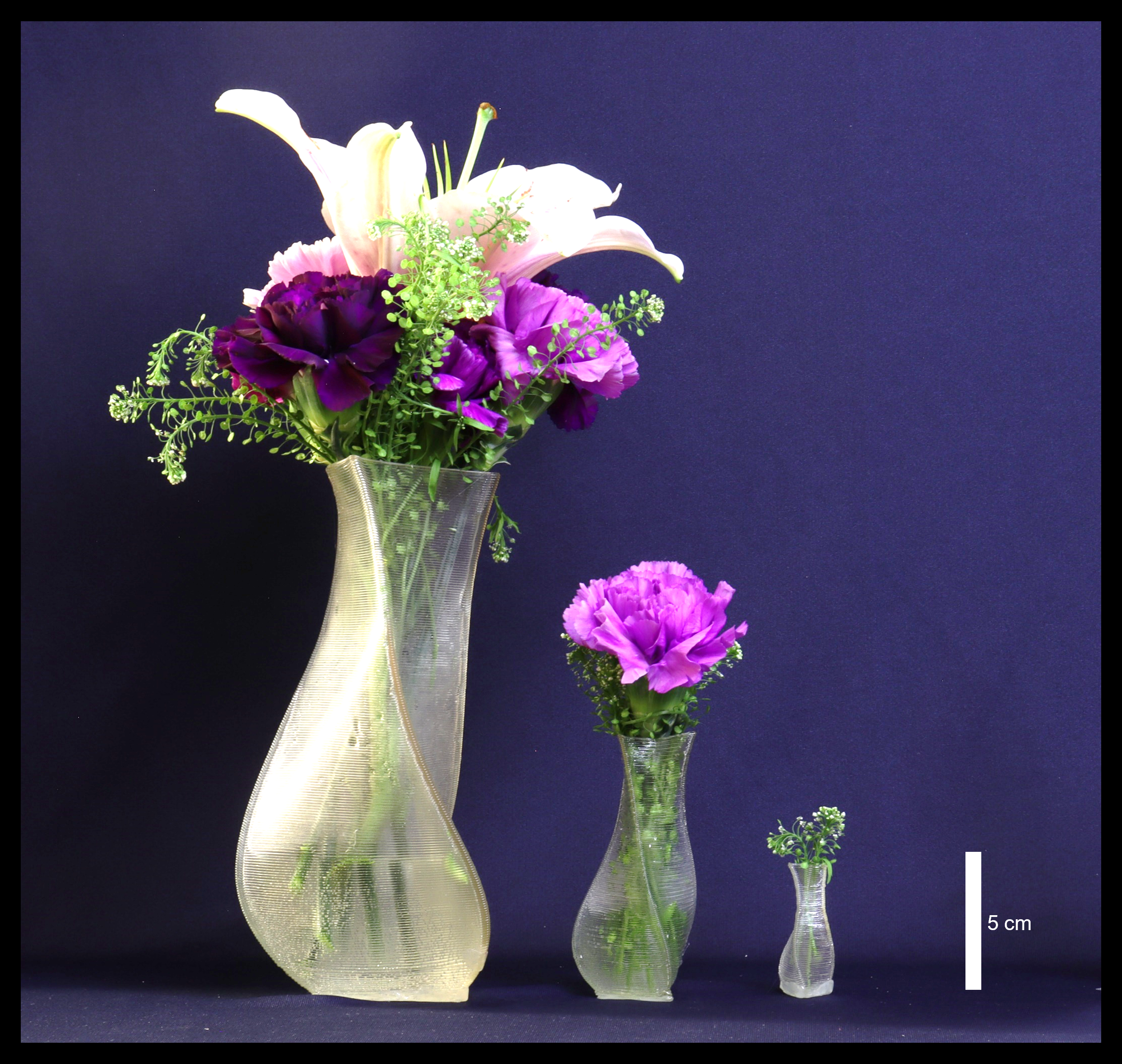 Pellet printed vases demonstrating various printing scales.